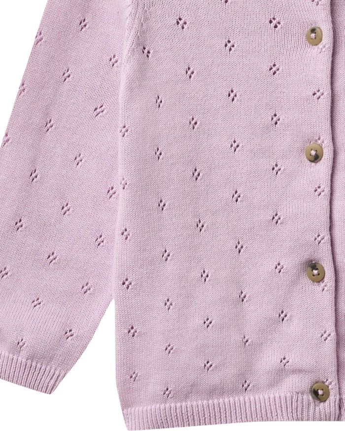 Close-up of a light purple cardigan with button details on a white background