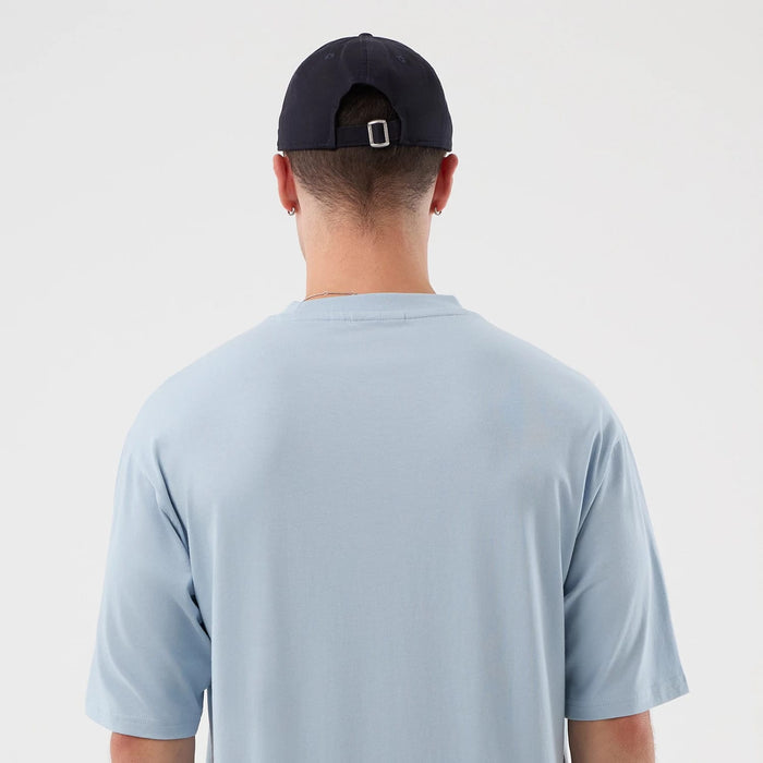 The model is wearing this MLB Script New York Yankees Oversized T-Shirt in pastel blue. 7