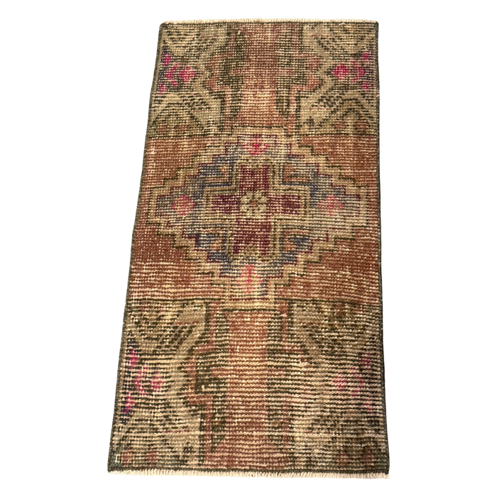 Shop the Romy Mini Rug in earthy rust with raspberry accents and a geometric medallion. A richly patterned accent measuring 34 x 17¼ inches. $72.