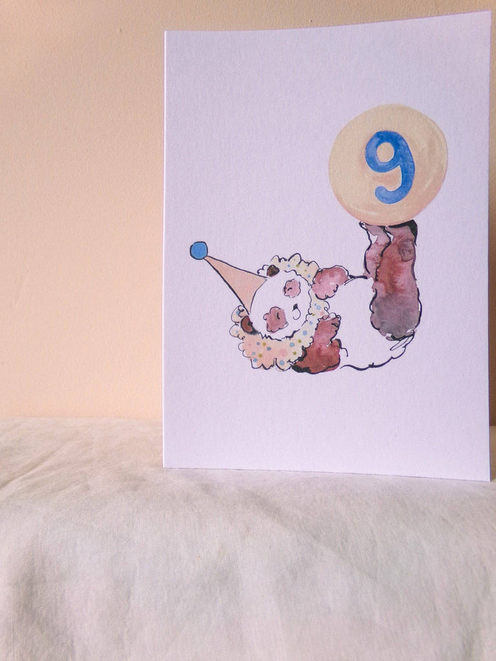 Illustration of a clown with a balloon number 9 on a white background
