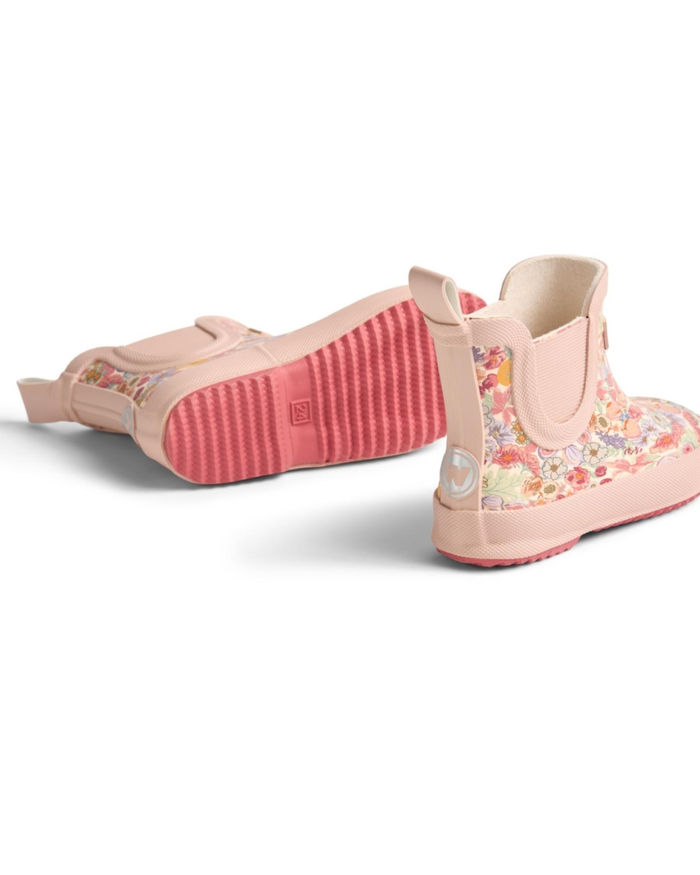 Pair of pink floral rain boots on a white background