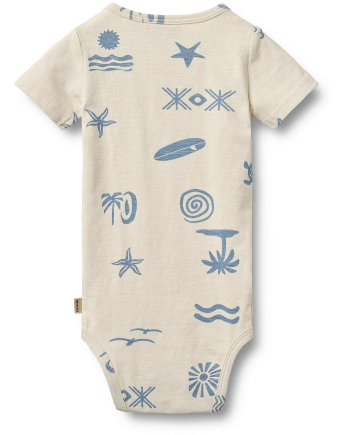 Beige baby onesie with blue ocean-themed patterns on a white background