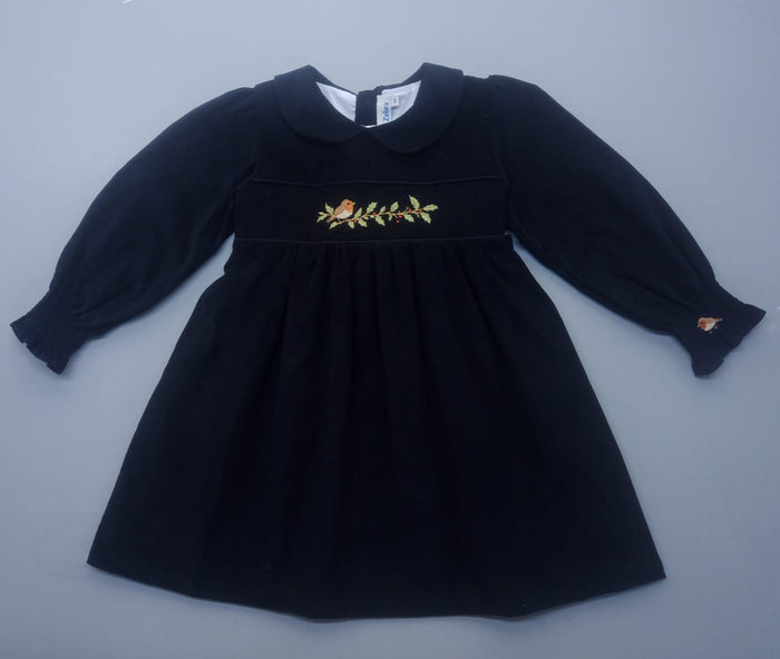 Black dress with floral embroidery on a gray background
