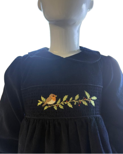 Navy blue dress with embroidery on a mannequin against a white background
