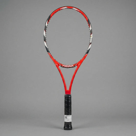A red and black HEAD tennis racket with a black wrapped grip, standing upright against a solid gray background.