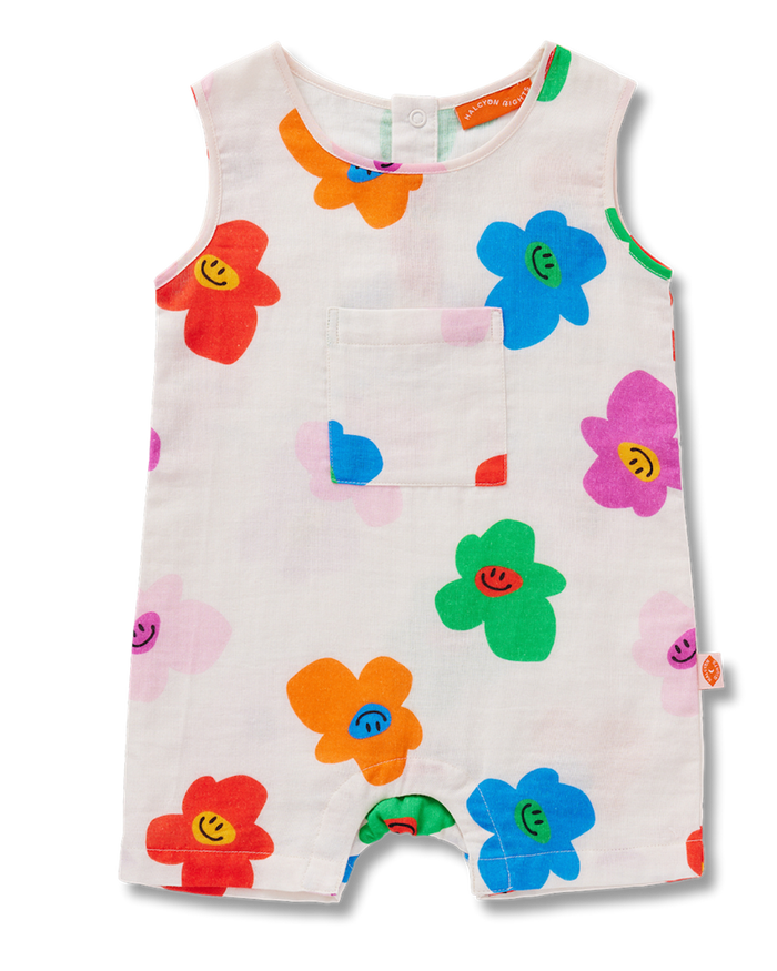 Colorful children's romper with floral patterns on a white background