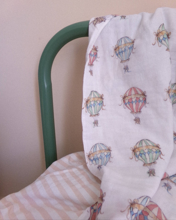 La La Lu Hot Air Balloon cotton muslin baby swaddle blanket in colourful watercolour design.