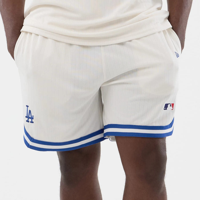 The model is wearing this MLB Arch LA Dodgers Oversized Shorts in open white. 5