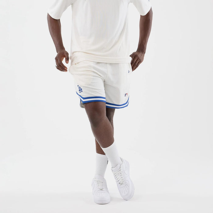 The model is wearing this MLB Arch LA Dodgers Oversized Shorts in open white. 7