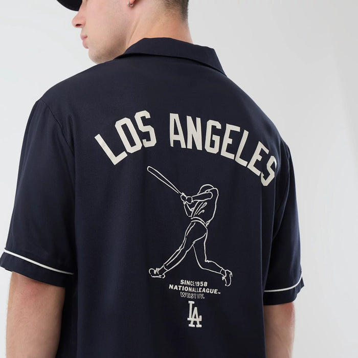 The model is wearing this MLB Graphic Revere LA Dodgers Short Sleeve Shirt in navy. 4