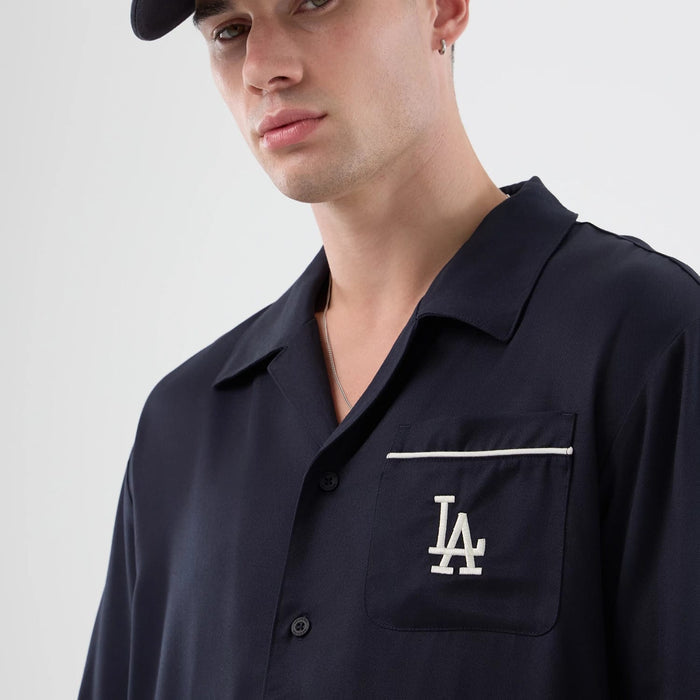 The model is wearing this MLB Graphic Revere LA Dodgers Short Sleeve Shirt in navy. 5