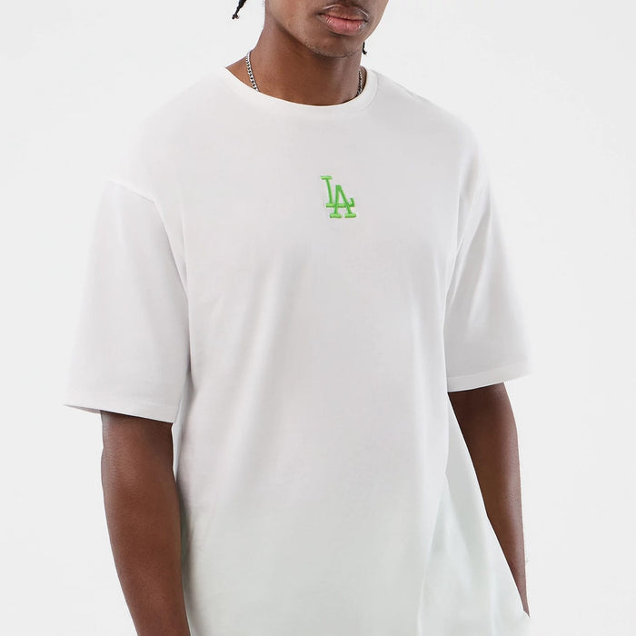 The model is wearing this MLB League Essential LA Dodgers Oversized T-Shirt in white. 8