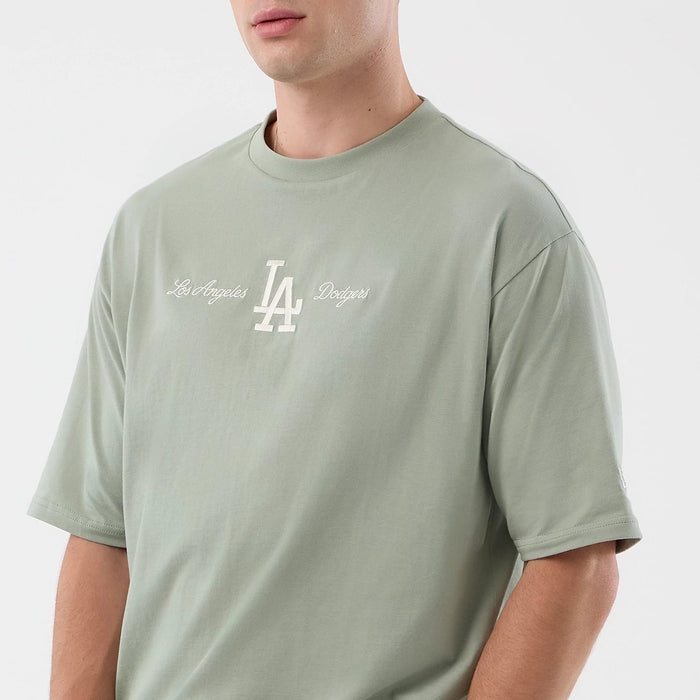 The model is wearing this MLB Script LA Dodgers Oversized T-Shirt in pastel green. 6