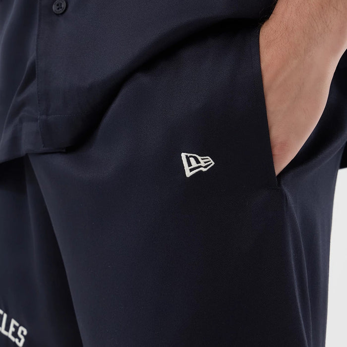 The model is wearing this MLB Woven LA Dodgers Shorts in navy. 5