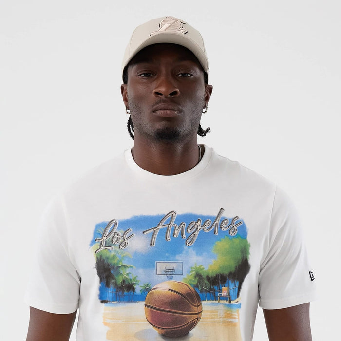The model is wearing this NBA Beach Graphic LA Lakers T-Shirt in white. 5