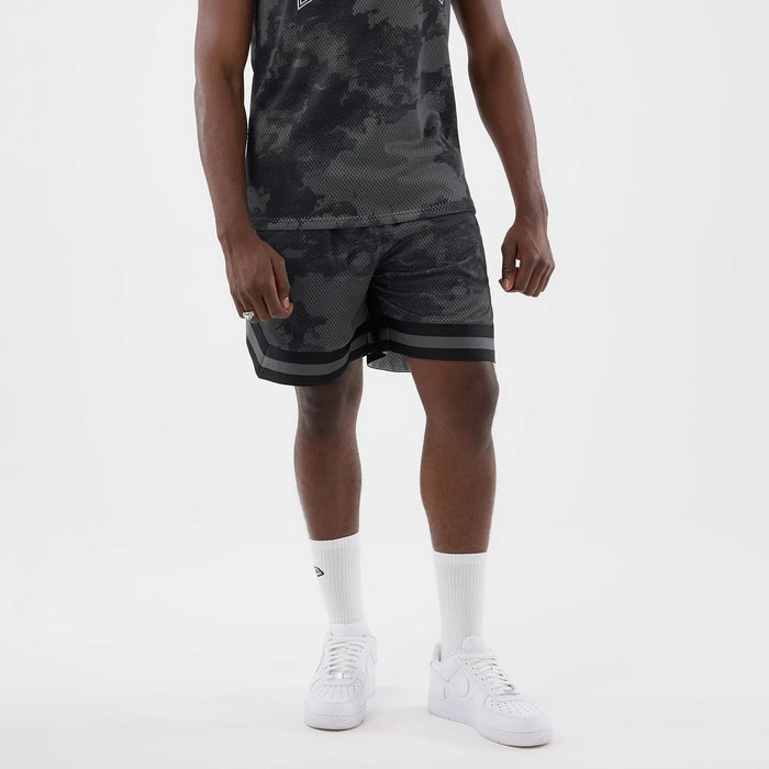 The model is wearing this New Era All Over Print Mesh Shorts in black camo. 8