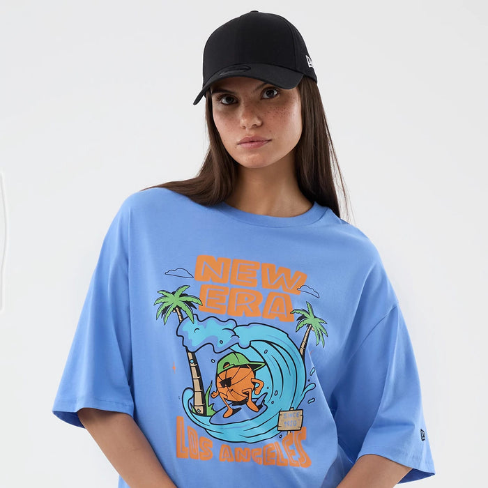 The model is wearing this New Era Basketball Character Graphic T-Shirt in pastel blue. 6