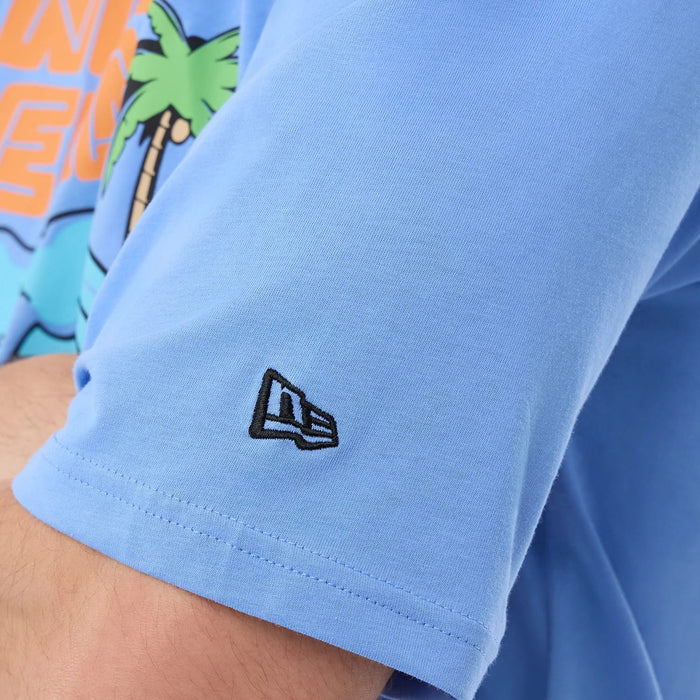 The model is wearing this New Era Basketball Character Graphic T-Shirt in pastel blue. 7