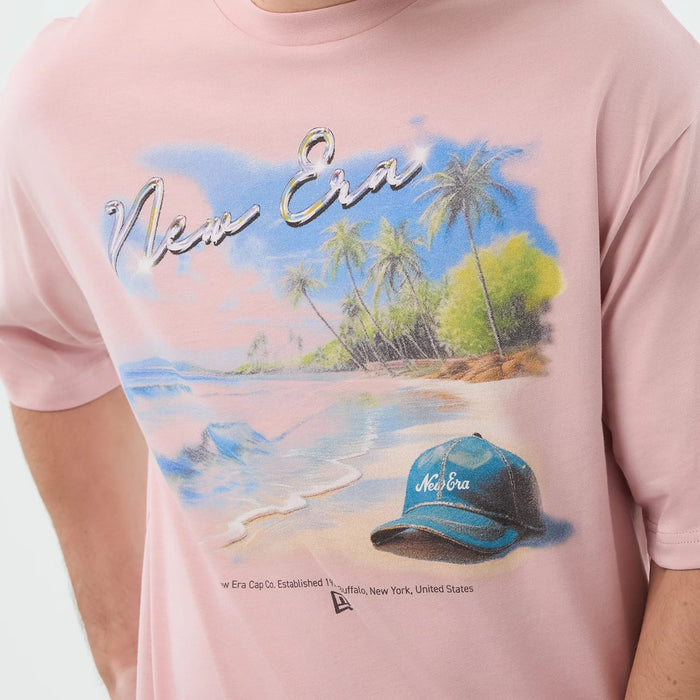 The model is wearing this New Era Beach Graphic Oversized T-Shirt in pastel pink. 5