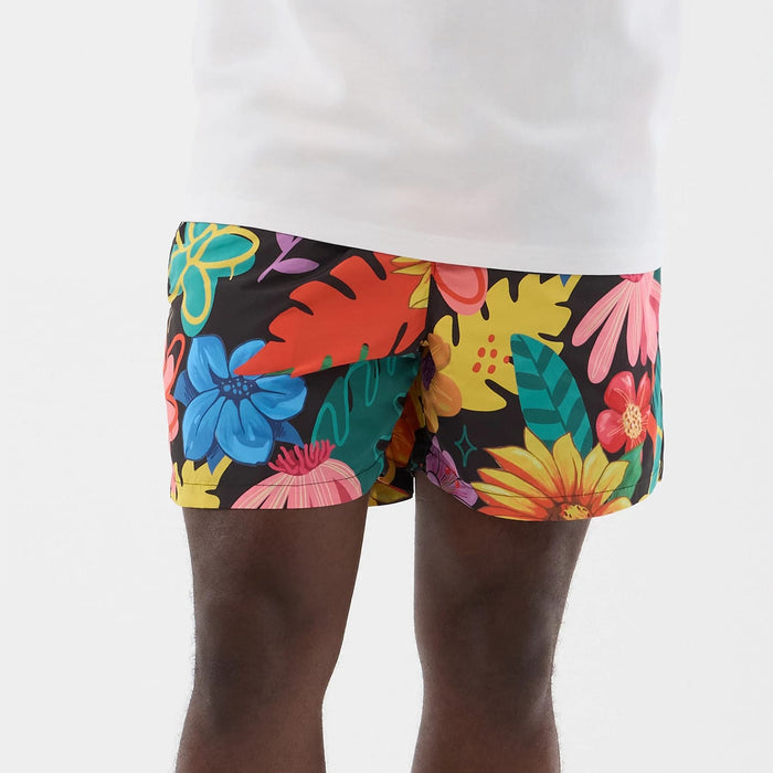 The model is wearing this New Era Floral Swimming Shorts in black. 5