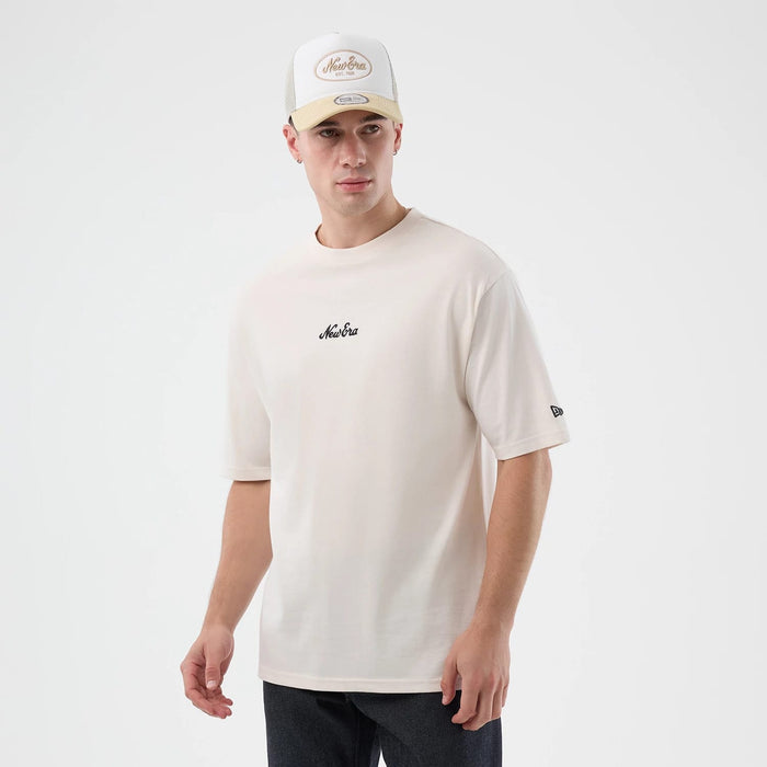 The model is wearing this New Era Floral Graphic Oversized T-Shirt in open white. 3