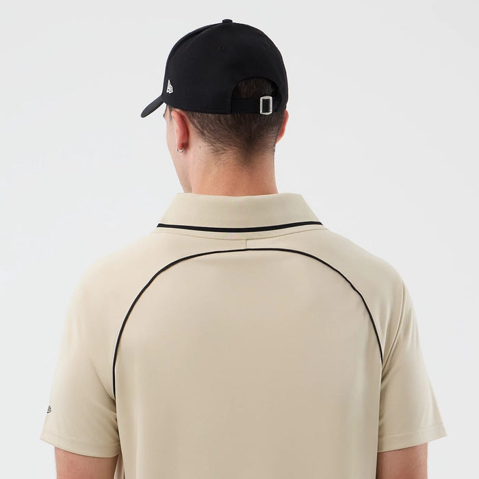 The model is wearing this New Era Football T-Shirt in light beige. 7