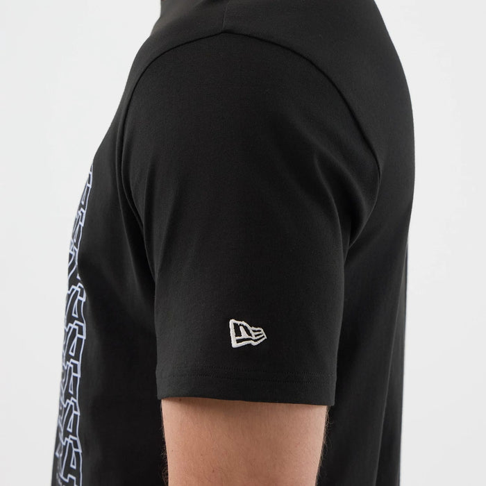 The model is wearing this New Era Logo Graphic T-Shirt in black. 5