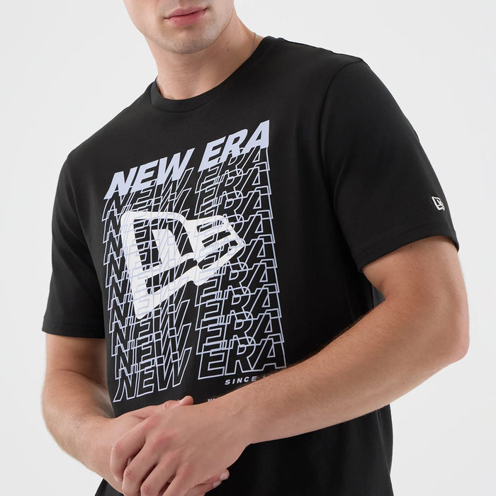 The model is wearing this New Era Logo Graphic T-Shirt in black. 6