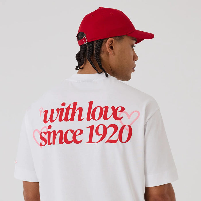 The model is wearing this New Era Love Graphic T-Shirt in white. 6