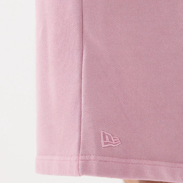 The model is wearing this New Era Originators Oversized Shorts in pink. 6