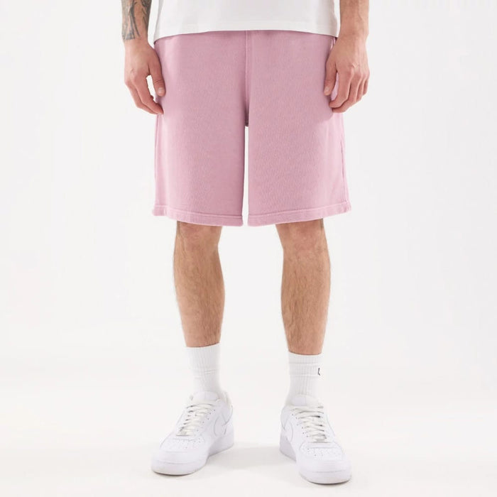 The model is wearing this New Era Originators Oversized Shorts in pink. 7