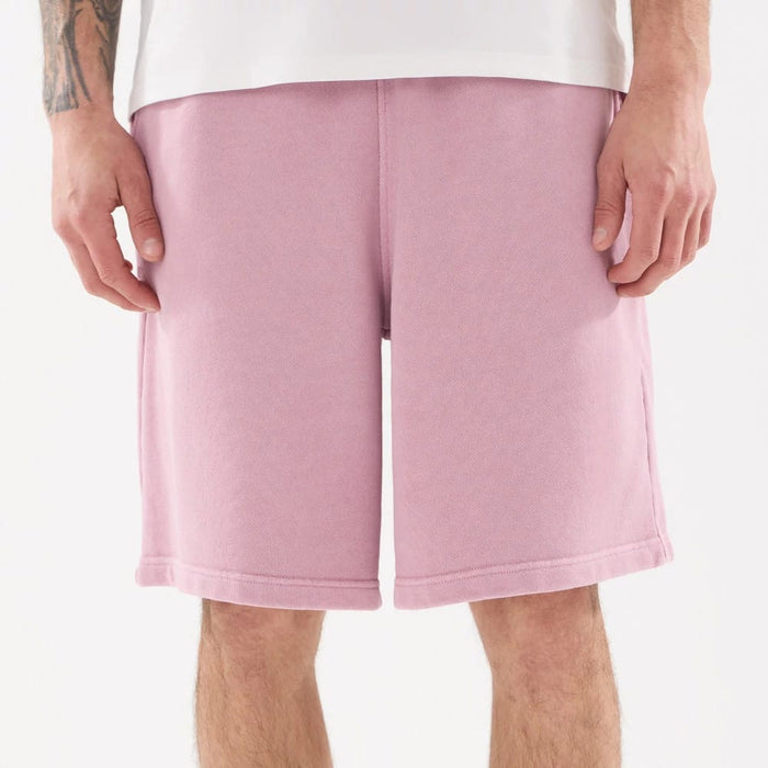 The model is wearing this New Era Originators Oversized Shorts in pink. 8