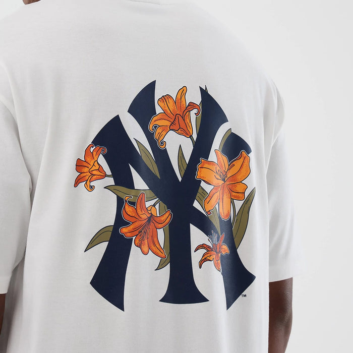 The model is wearing this MLB Floral New York Yankees Oversized T-Shirt in white. 4