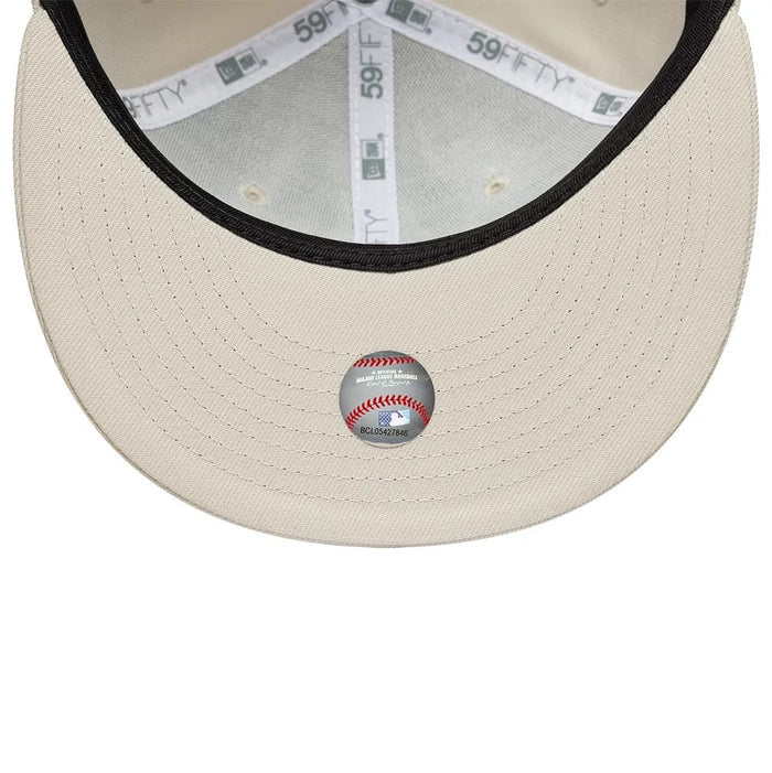 Pictured is this MLB New York Yankees 59FIFTY Fitted cap in light beige. 2
