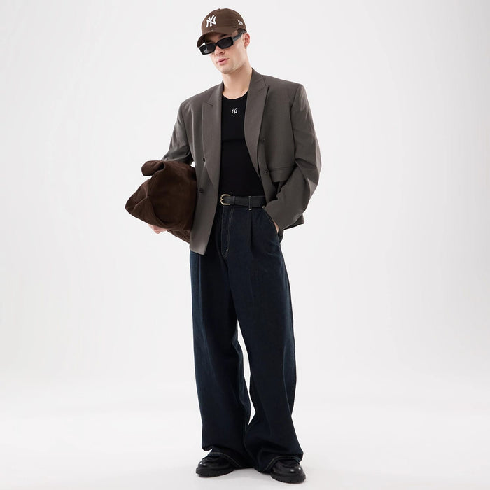 The model is wearing this MLB Rib New York Yankees Vest in black. 4