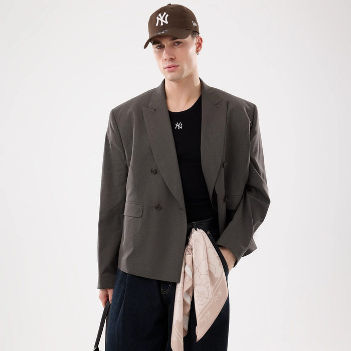 The model is wearing this MLB Rib New York Yankees Vest in black. 7