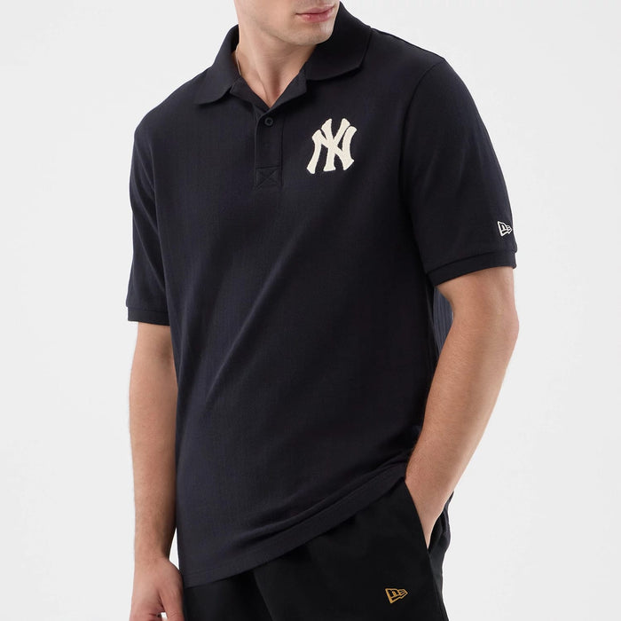 The model is wearing this MLB Rib New York Yankees Polo T-Shirt in navy. 6