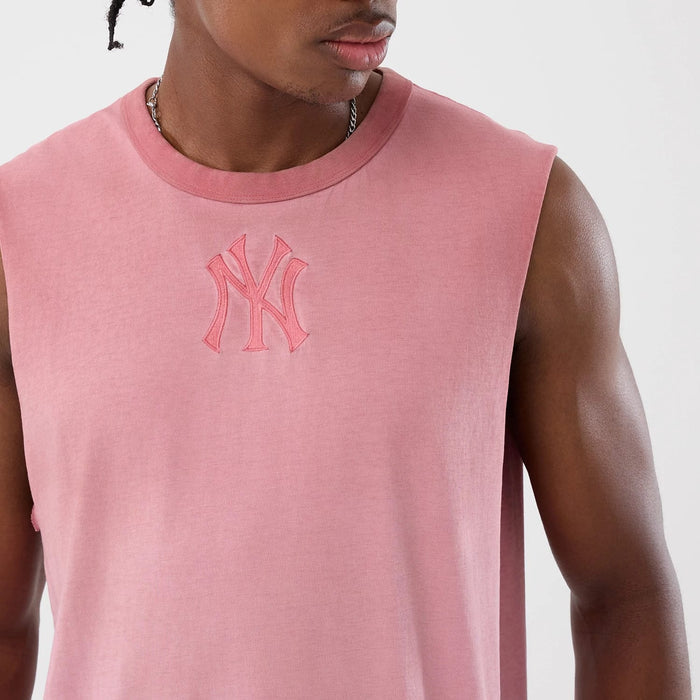 The model is wearing this MLB Washed Logo New York Yankees Vest in pastel pink. 5