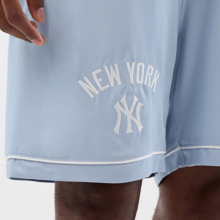 The model is wearing this MLB Woven New York Yankees Shorts in pastel blue. 4