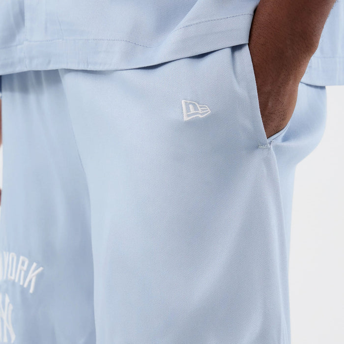 The model is wearing this MLB Woven New York Yankees Shorts in pastel blue. 5