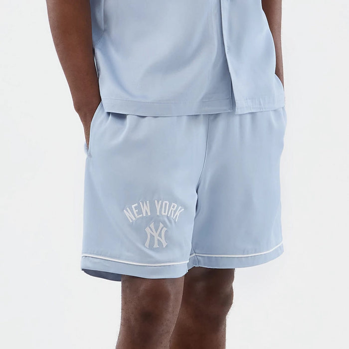 The model is wearing this MLB Woven New York Yankees Shorts in pastel blue. 6