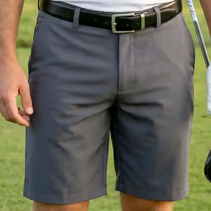 charcoal golf shorts for men worn by a person on a golf course