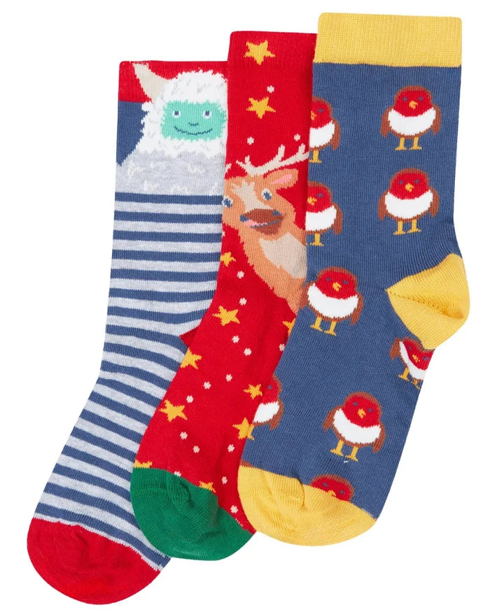 Three pairs of colorful socks with festive designs on a white background