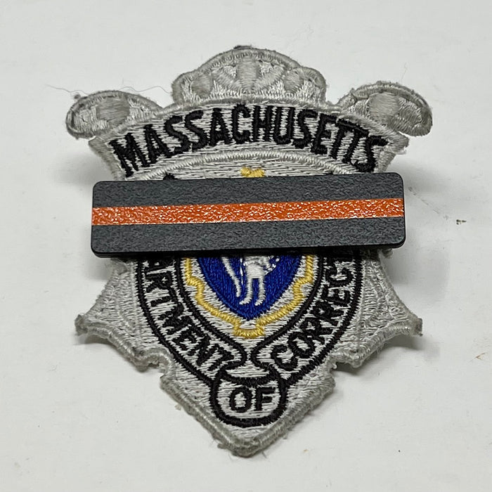 The Stop Gun Violence Wear Orange Awareness / Thin Orange Line Mourning Bars for Cloth Badges and insignia.  Black vinyl with a thin orange line mourning bar with a pair of 1/2" pins with military clasps.  Public safety officers are wearing thin orange line badge shrouds to raise awareness of gun violence in the community and among police officers, firefighters, Emergency Medical Services and others.  J