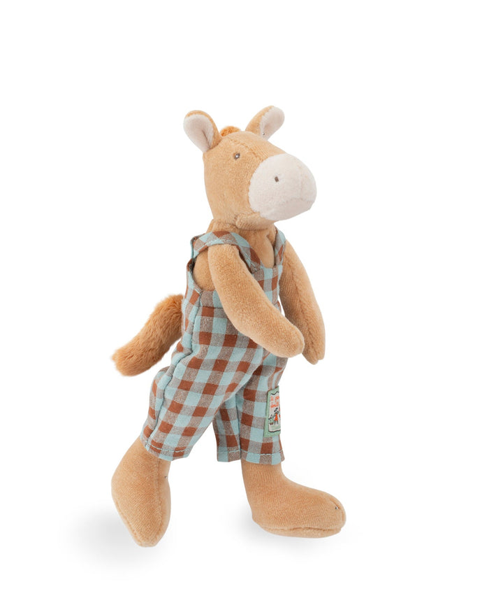 Stuffed animal toy with checkered overalls on a white background