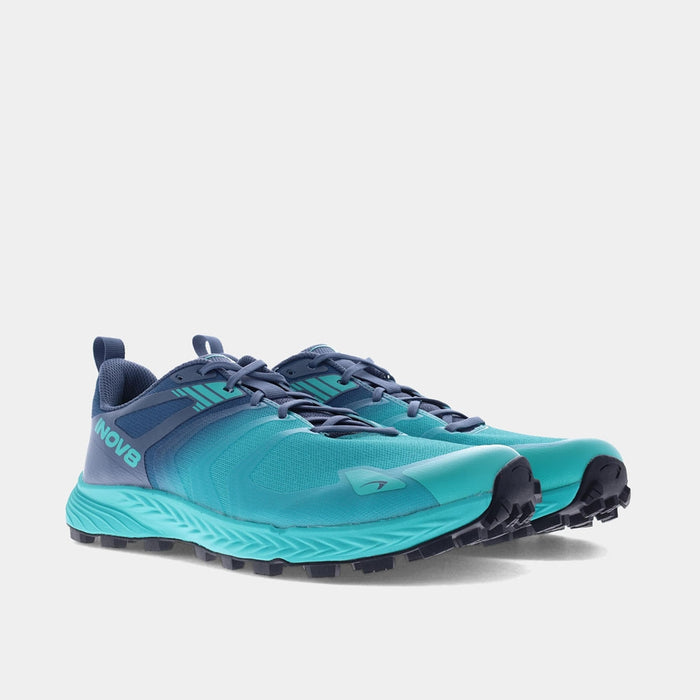 Pair of INOV8 TrailTalon Speed trail running shoes, teal and blue, angled view