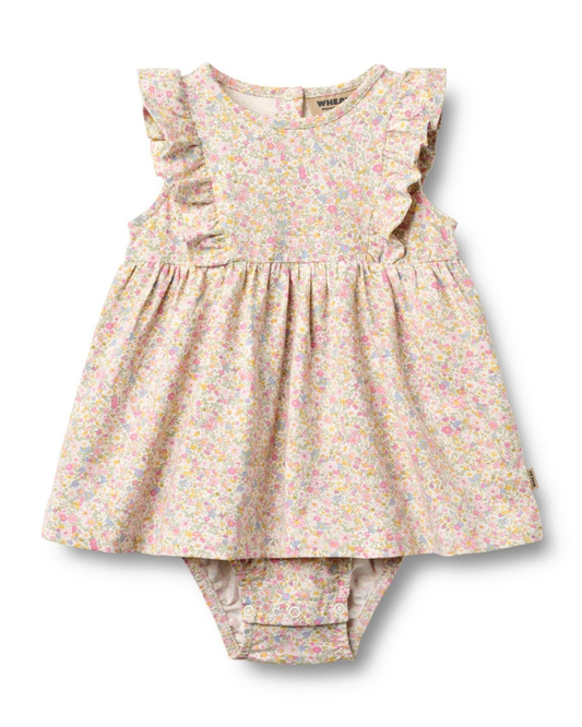 Floral baby dress and bloomers set on a white background