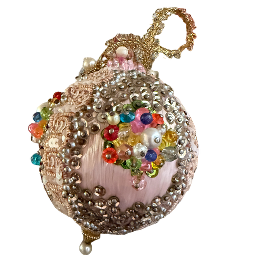 Vintage blush pink ball ornament with multicolored bead clusters, sequin borders, pink decorative braid, and a pearl-look drop.