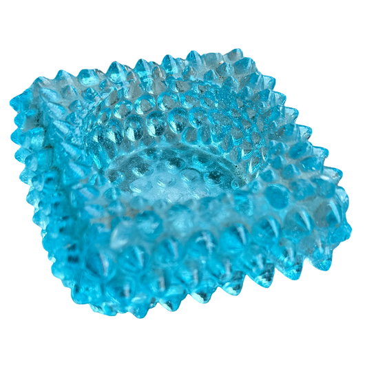 Blue textured ball on a white background