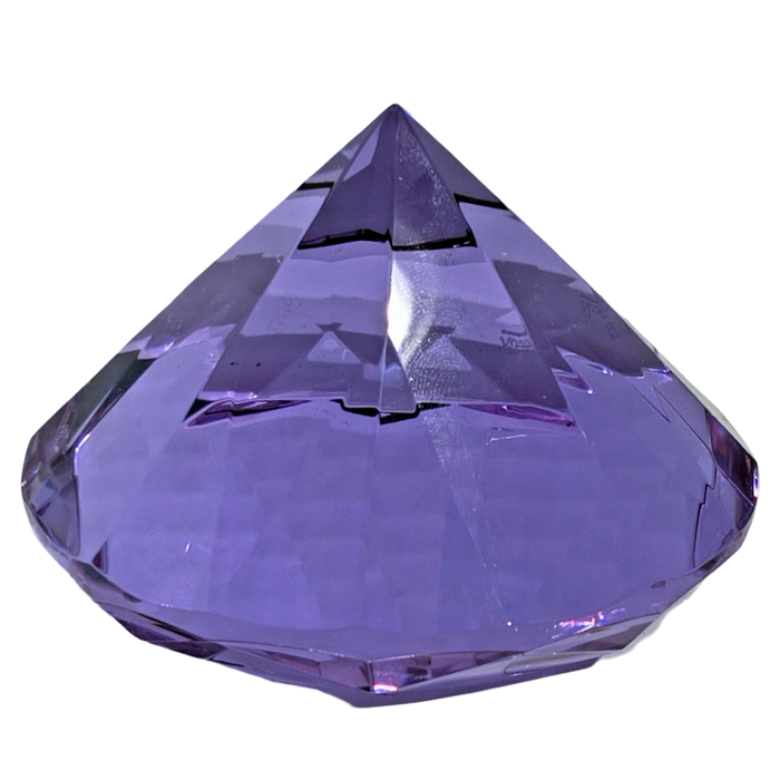 Faceted purple crystal on a white background